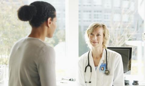 Woman and physician talking