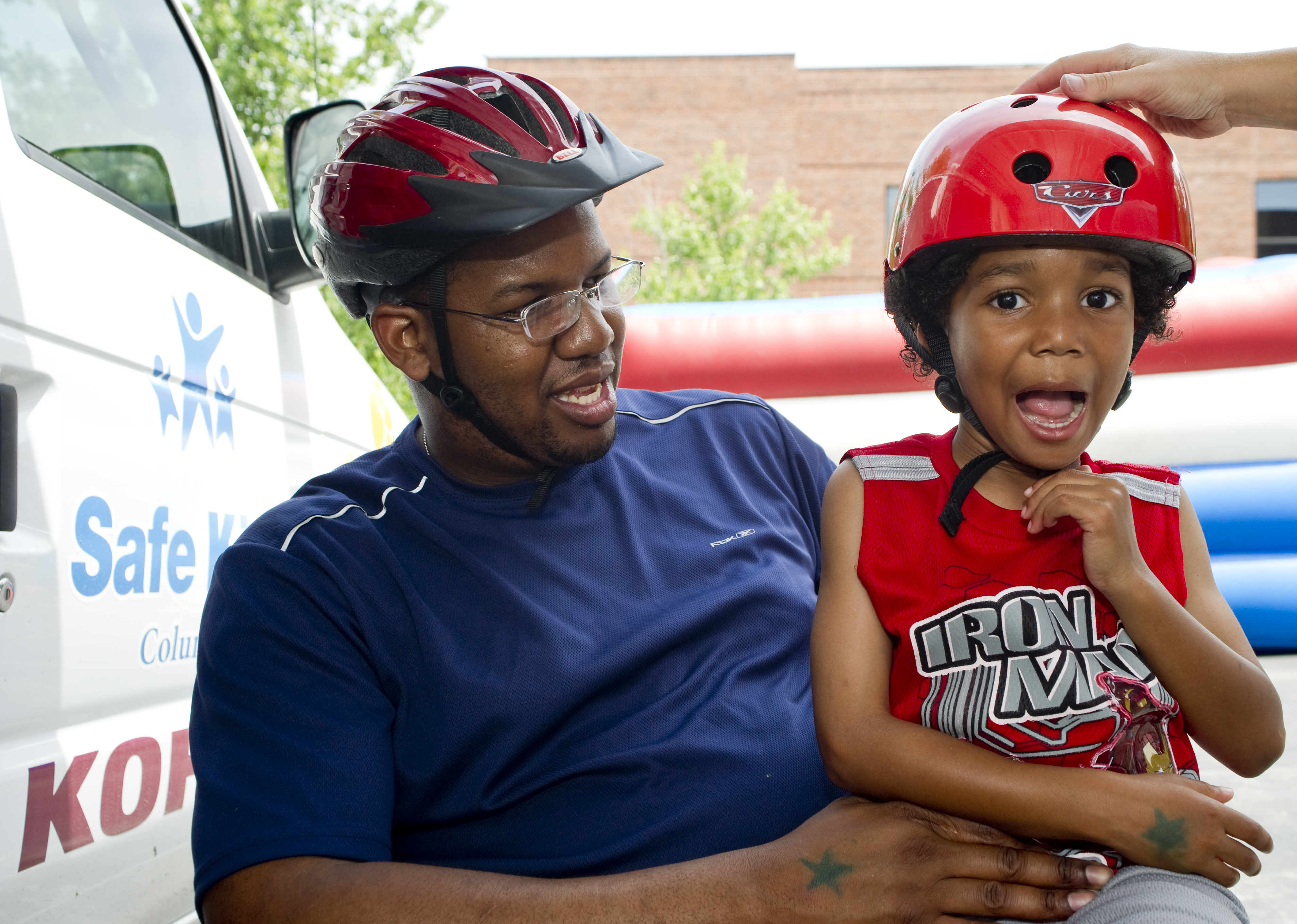 safe kids day parent and child with helmets