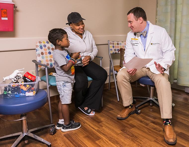 Ryen Chism and Brittney Young meet with pediatric hematologist Tyler Severance, MD