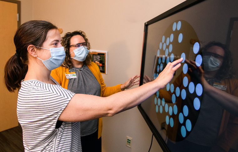 photo of mu health care neurologic physical therapist working with patient