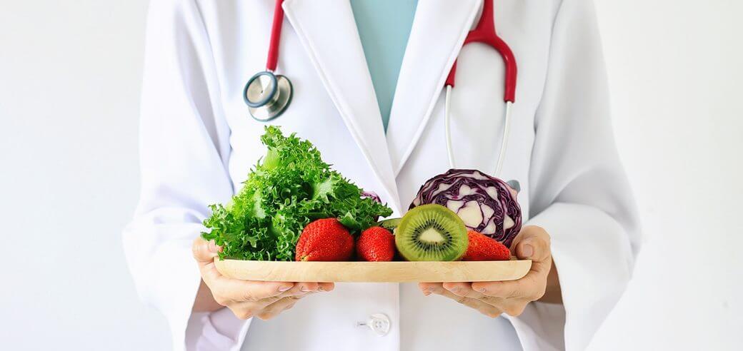 photo of doctor with healthy eating options