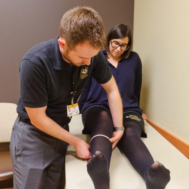 doctor examining patient knee