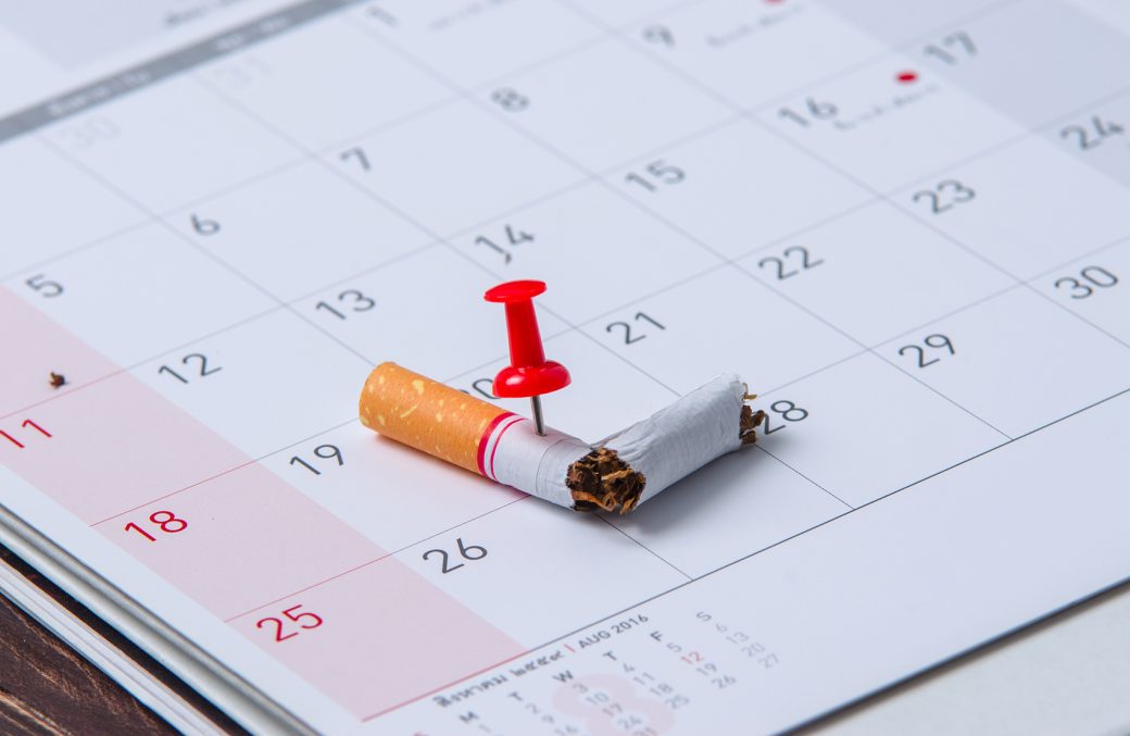 photo of broken cigarette on calendar