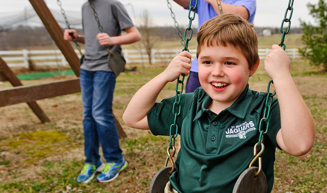 Photo of Mark McDonald on a swing.