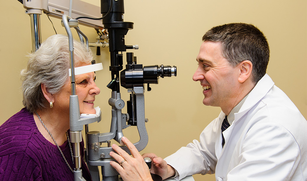 Frederick Fraunfelder, MD, MBA, performs an eye exam. 