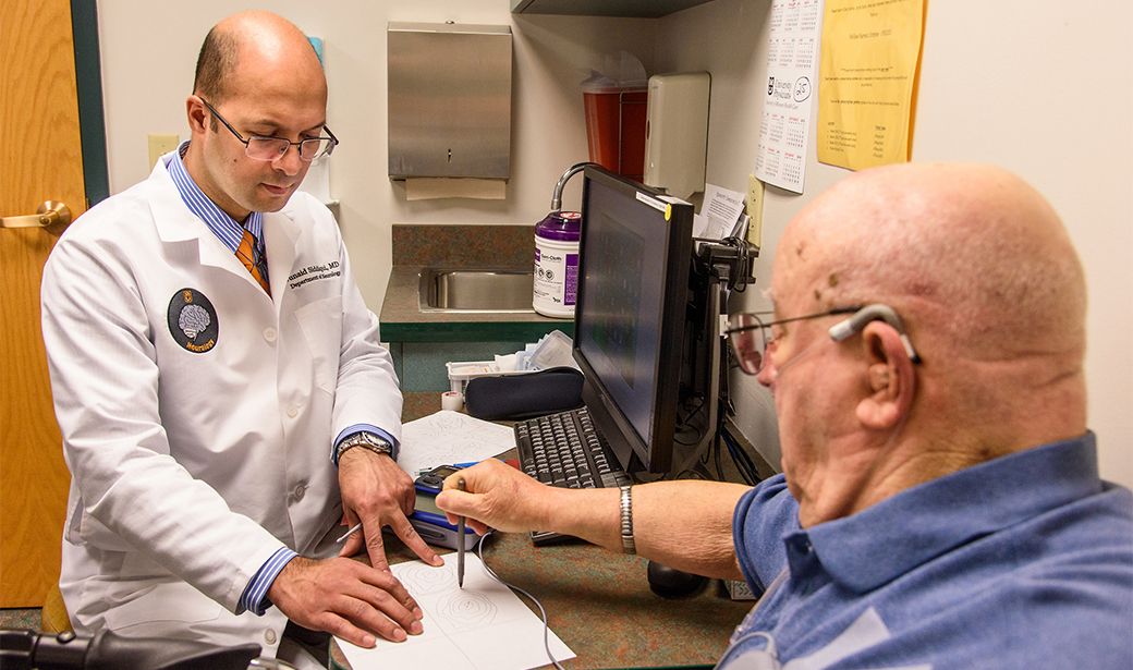 Junaid Siddiqui, MD, with patient