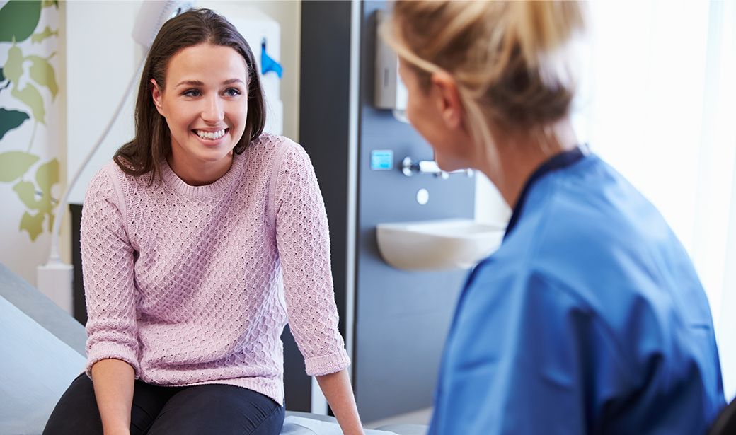 Photo of female nurse with female patient