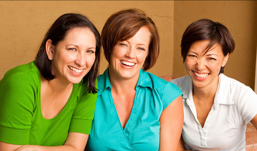 women talking and laughing