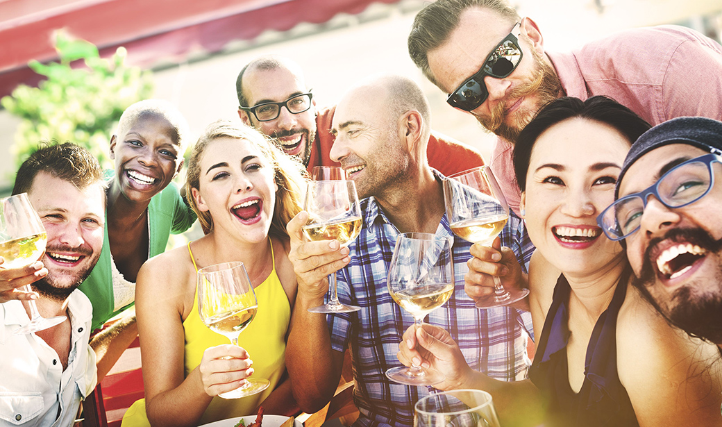 group of friends drinking at a summer party