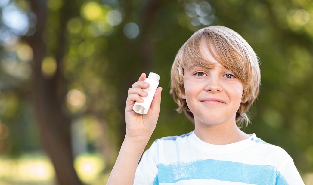 boy with asthma inhaler