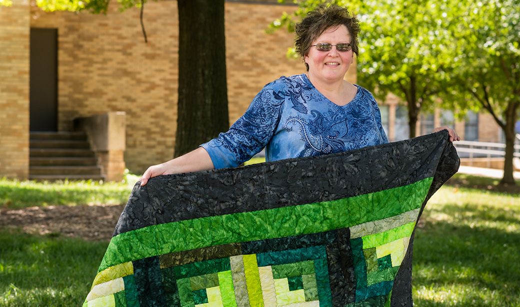 Brenda Duncan with quilt