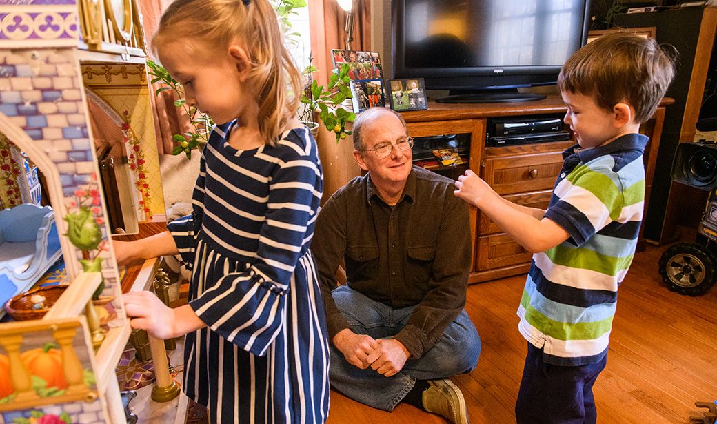 Paul Penn, thyroid cancer patient at Ellis Fischel, plays with his grandchildren.