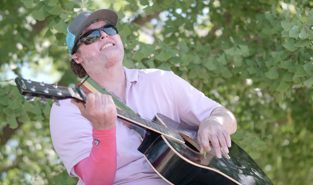 Eli Beasley playing the guitar