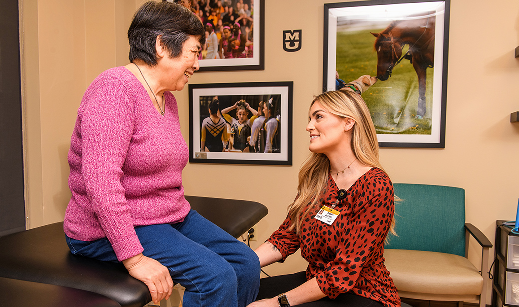 Sarah Moore, DPT, helps Ling Ling Wang at the Mizzou Therapy Services clinic in Fulton.