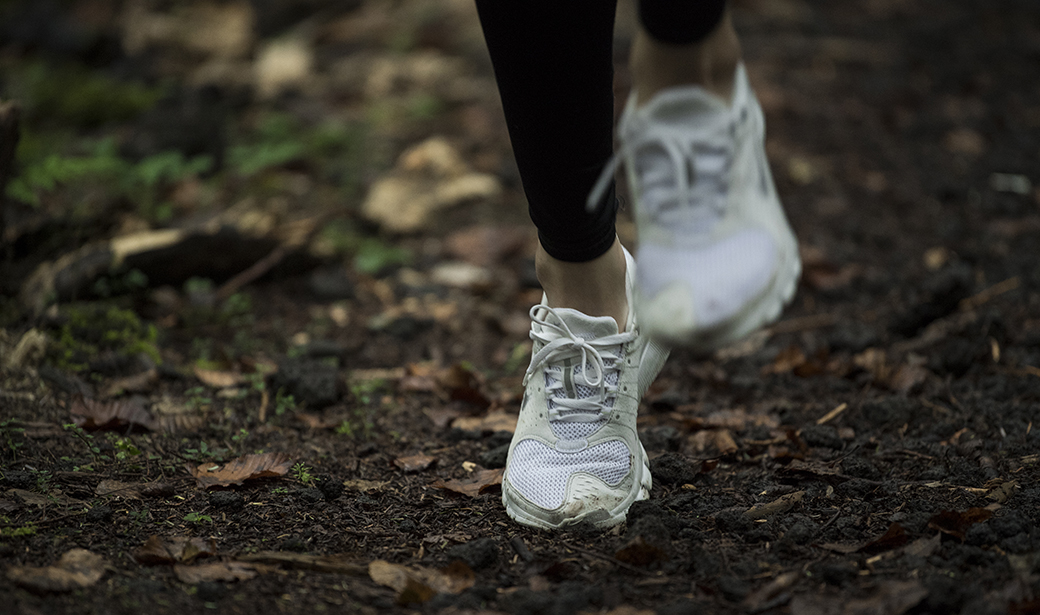 running shoes of a jogger on a trail