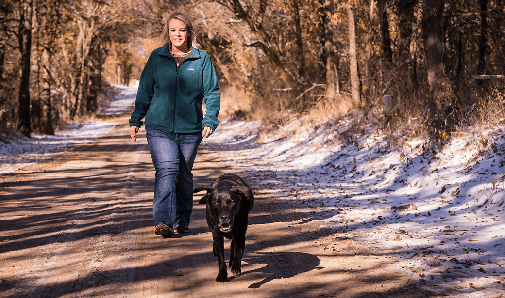 Megan Lawson walks with her dog after weight loss surgery