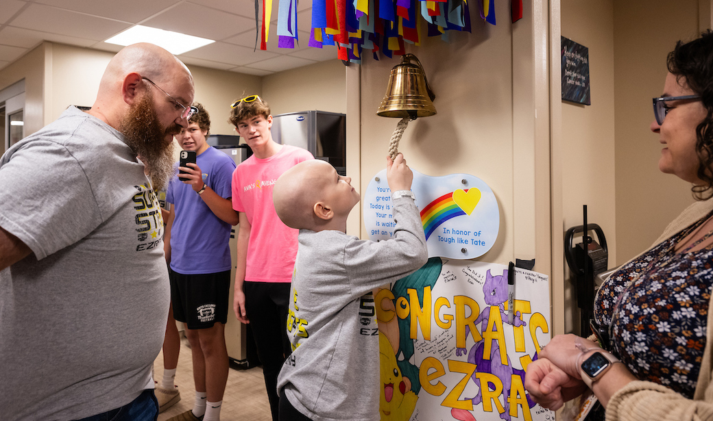 Ezra Schaefer ringing the bell