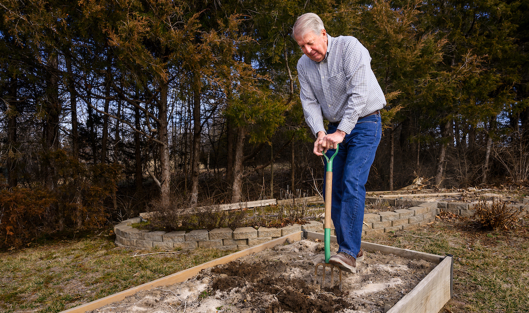 Larry Schepers working in his garden