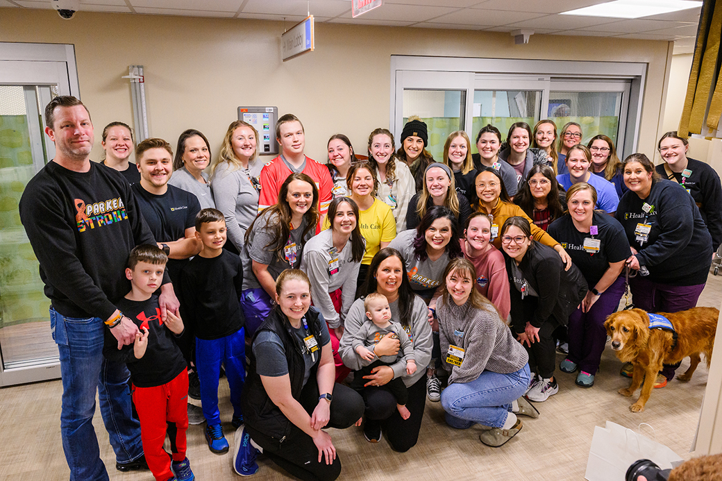 A group photo of people in a healthcare facility.
