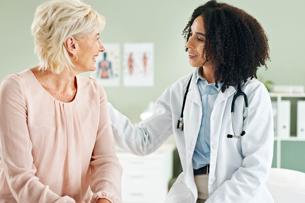 A physician speaks with a patient.