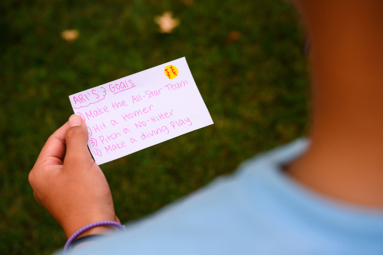 Arielle Rhodes looks over a notecard of goals she set for herself in 2025.