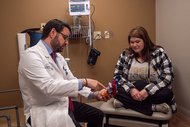 Gracyn talks with Kobrossi about her heart care plan during a follow-up appointment at the Heart and Vascular Clinic in Columbia.