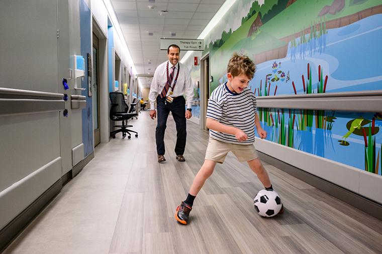 Bronson plays soccer with Dr. Rony Marwan during a visit to Children's Hospital in Columbia.
