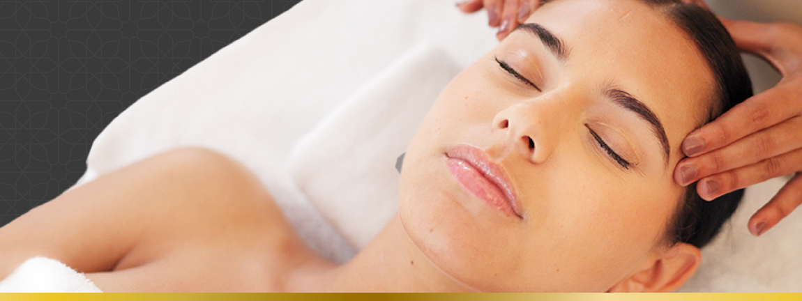 Woman laying down receiving a facial treatment