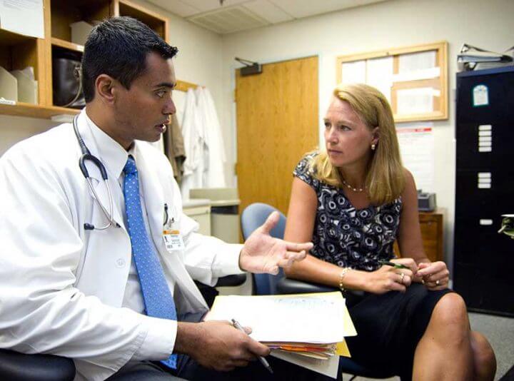Erika Ringdahl, MD, right, talks to resident physician Paresh Ghodge, MD, in 2007.