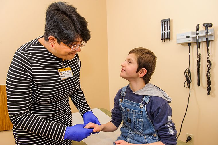 doctor with patient and mom
