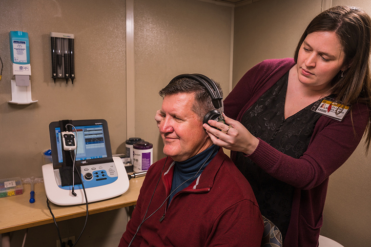 photo of audiologist and patient
