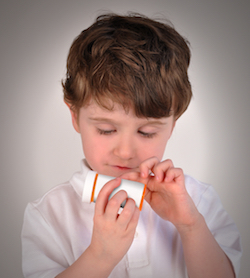 boy with pill bottle
