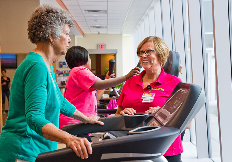 photo of cancer rehabilitation therapist and patient