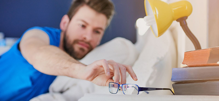 Man grabbing glasses