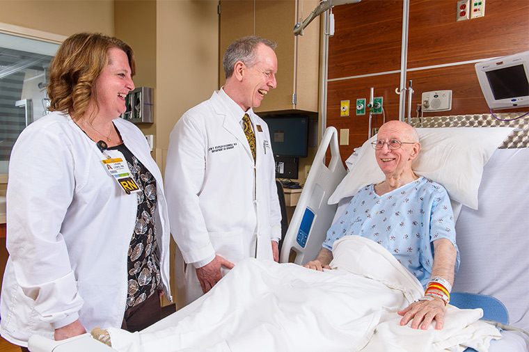 Photo of hospital patient and doctors. 