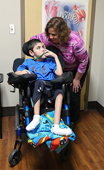 Jane Emerson, MD, with her patient, Tayden Washburn.