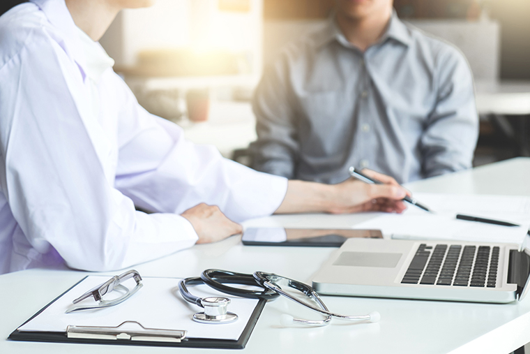 Photo of doctor consulting patient