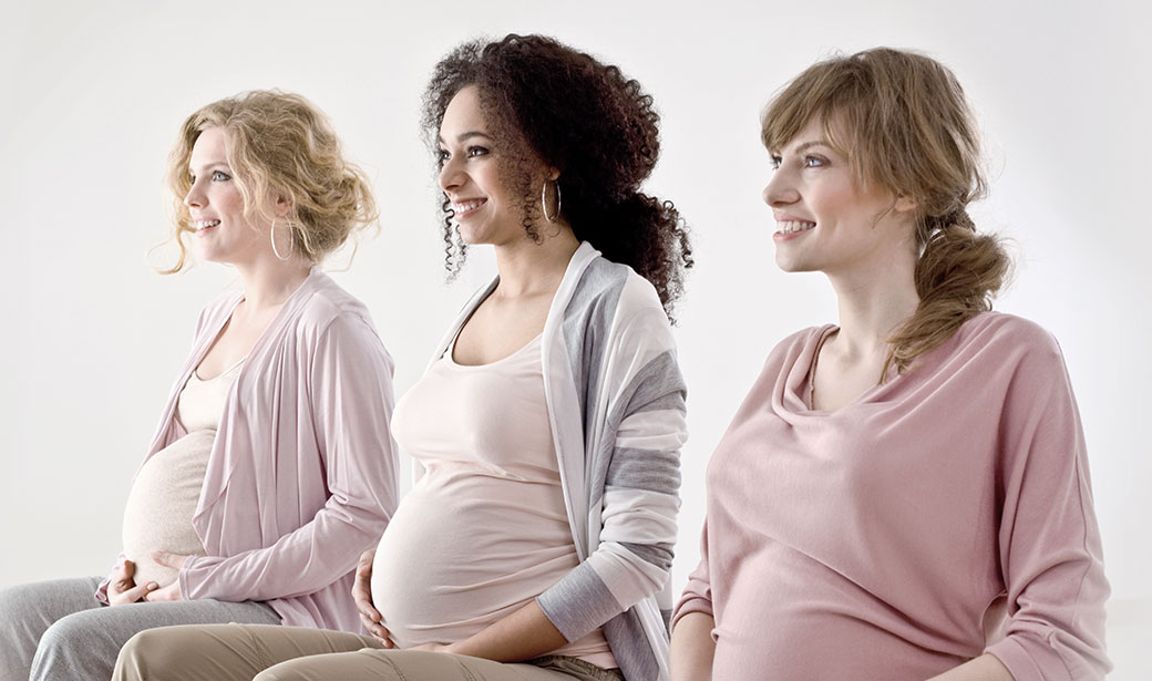 three pregnant women