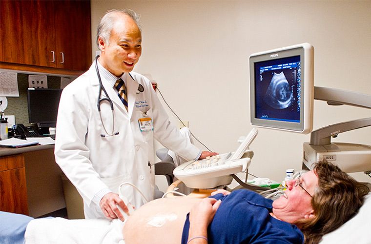 Photo of Dr. Winn doing an ultrasound.