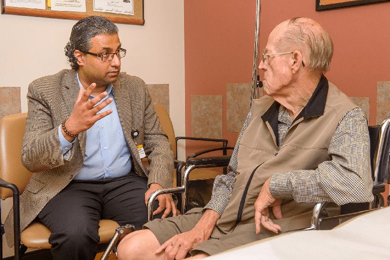 doctor meeting with elderly patient