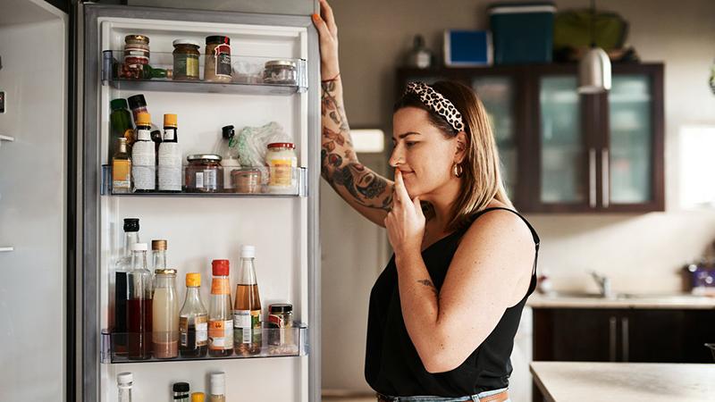 women looking into the refrigerator