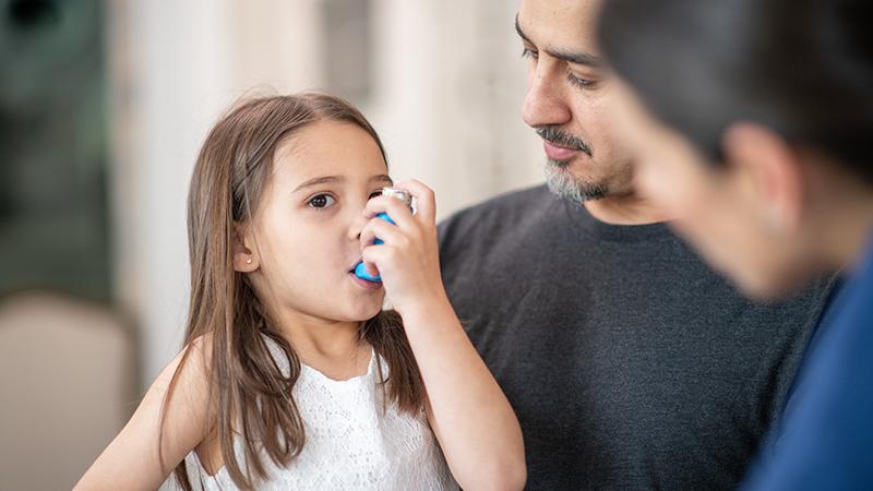 girl using inhaler