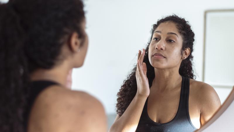 woman looking the mirror