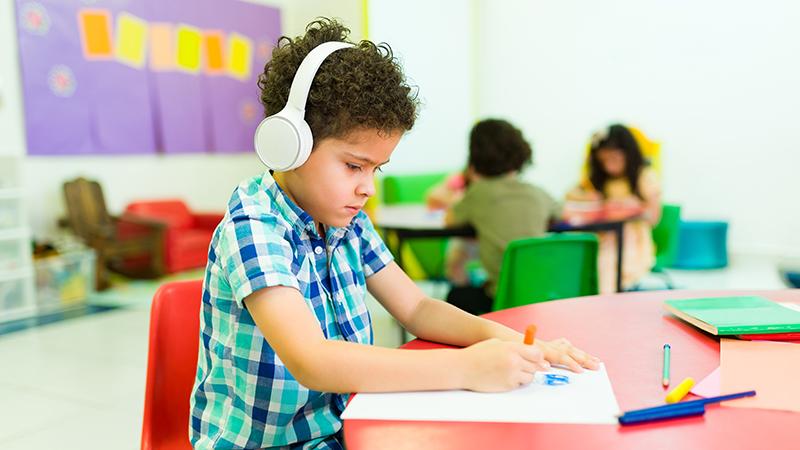 young boy wearing headphones