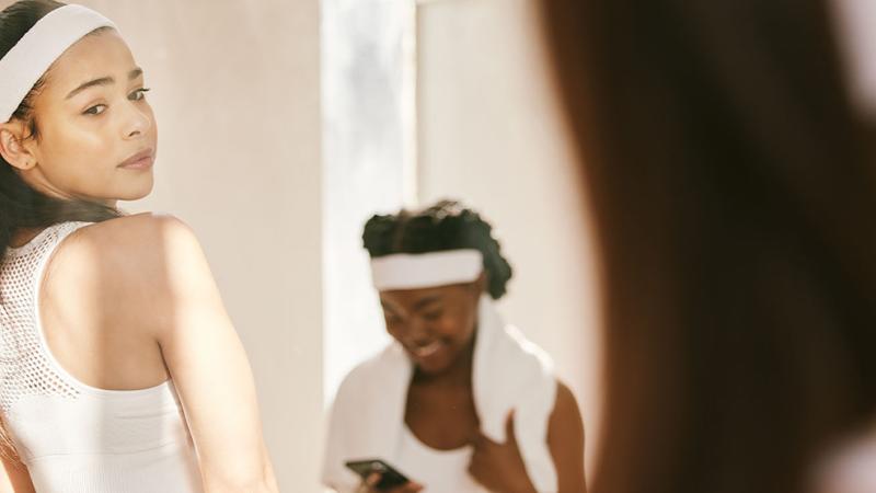 A woman look at herself in the mirror.
