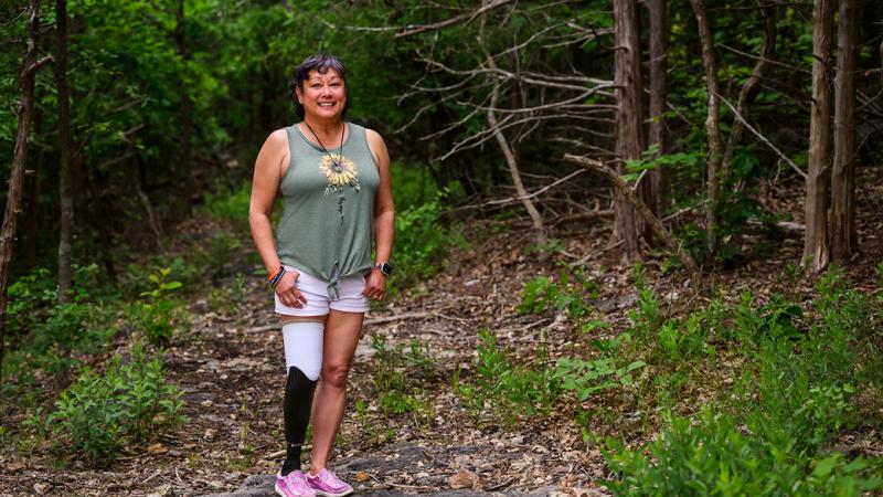 A photo of a woman outdoors.