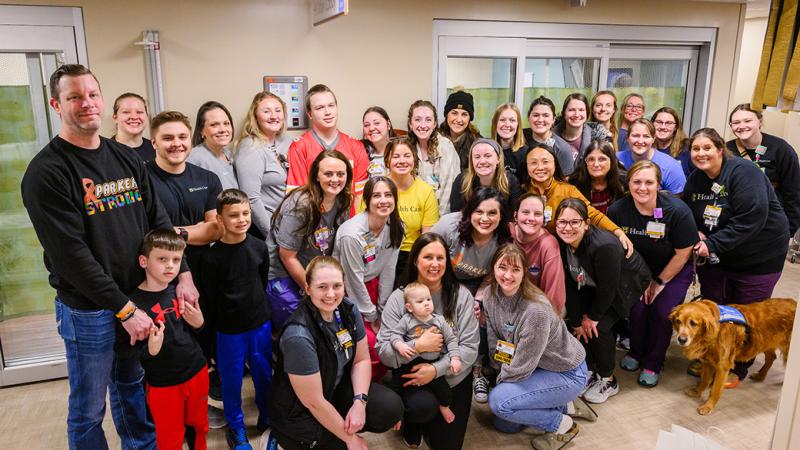 A group photo of people in a healthcare facility.