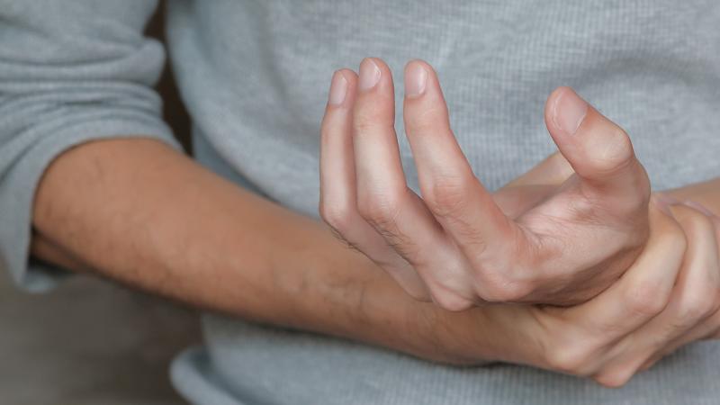 A person dealing with achy hands