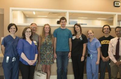 Casey O'Connor (center, t-shirt), his parents and care team.