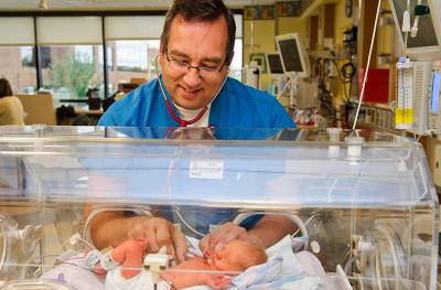 Baby in NICU with doctor
